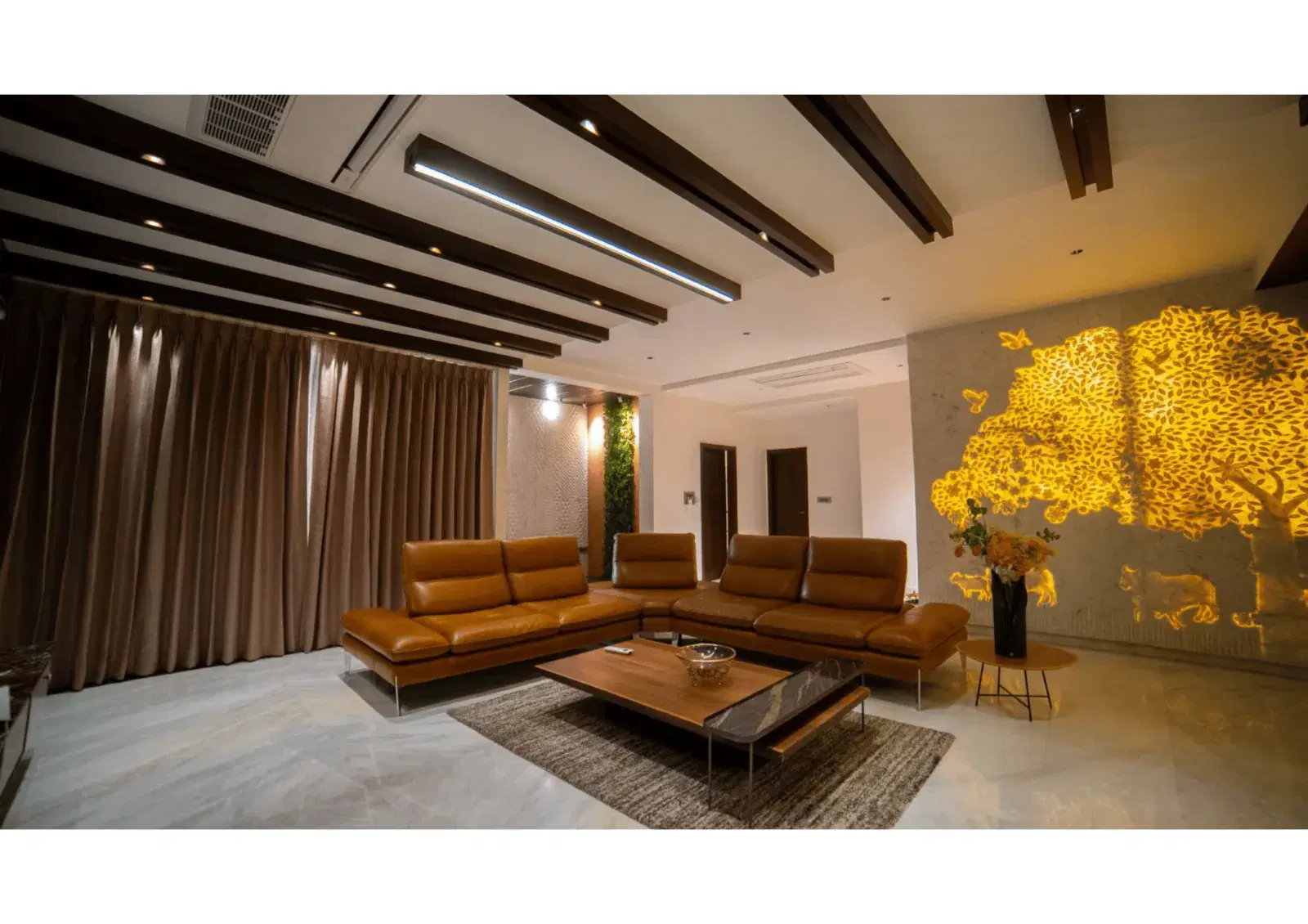 Cozy villa living area with leather sofas and golden accents